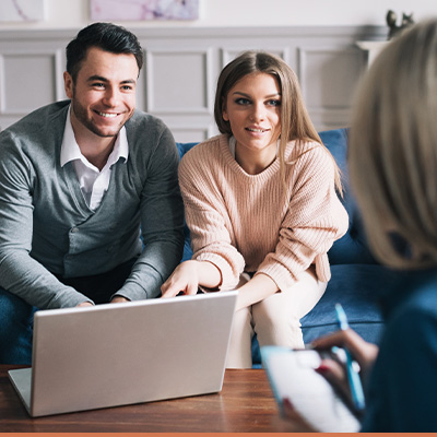 young couple talking to professional