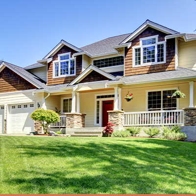 Exterior two story house, with front porch and landscaped yard