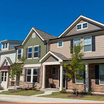 Townhouses in a row with blue sky