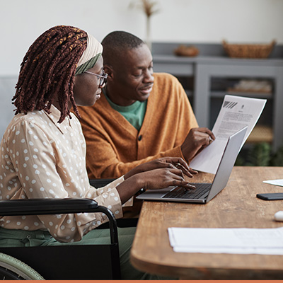 Woman working with lender to discuss paperwork