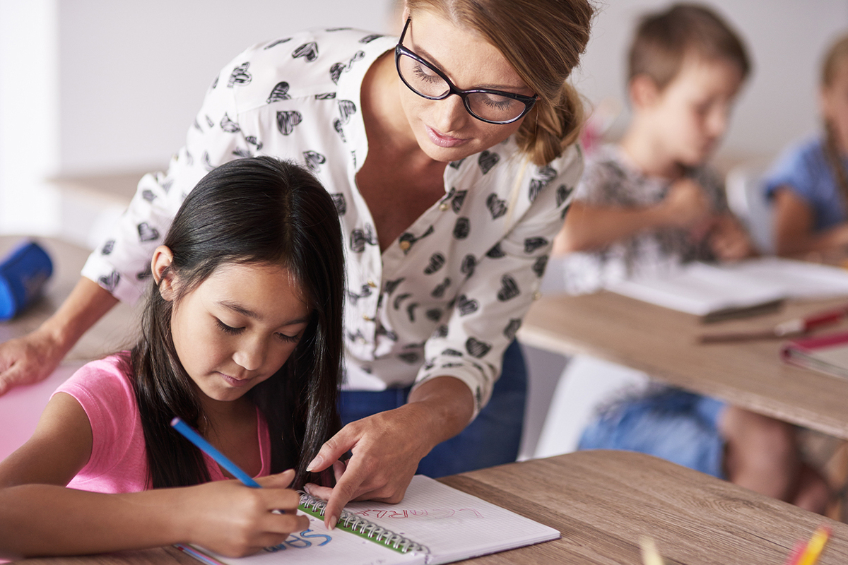 teacher teaching a student