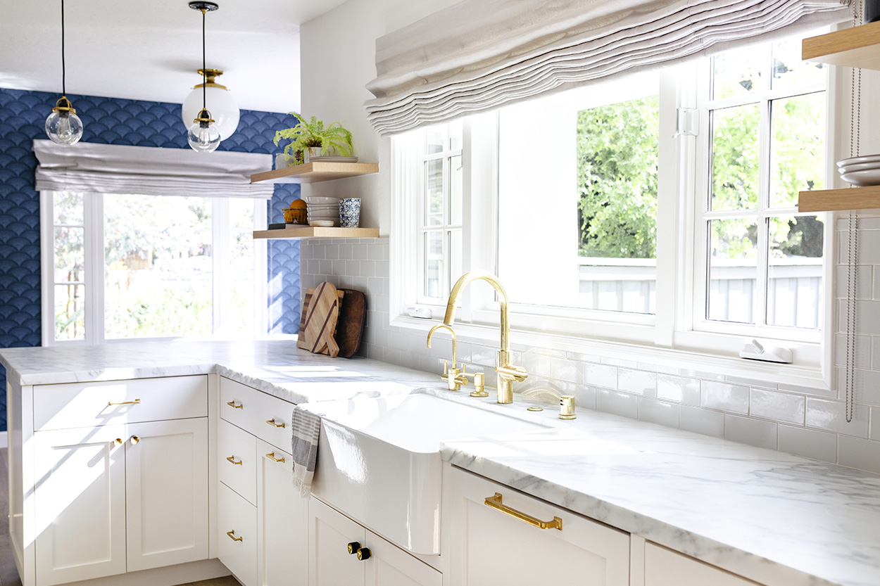 Remodeled kitchen with white cabinets and counter tops