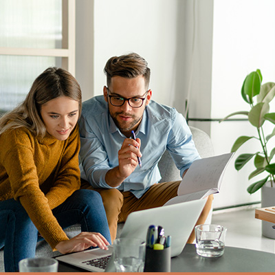 Young couple on laptop researching