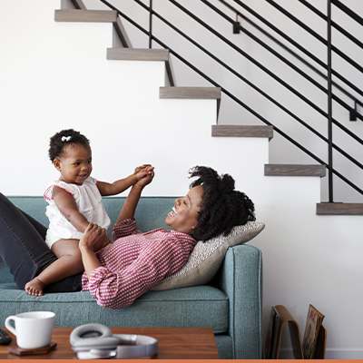 Mom and daughter on couch in livingroom 