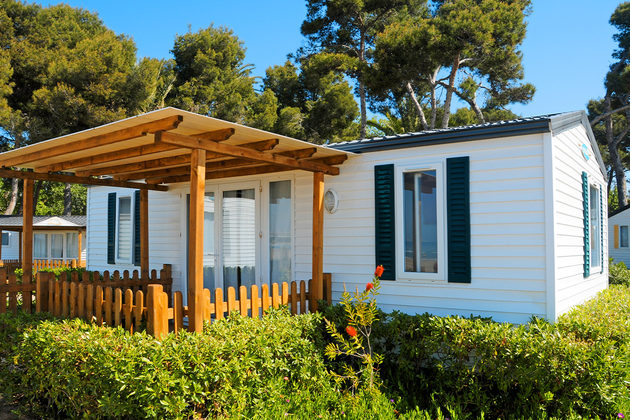 Mobile home exterior with wood pergola