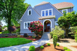 American craftsman house exterior with spring flowers in bloom