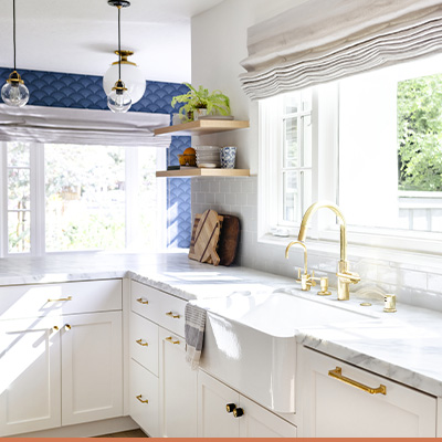 Remodeled kitchen with white cupboards and cabinets