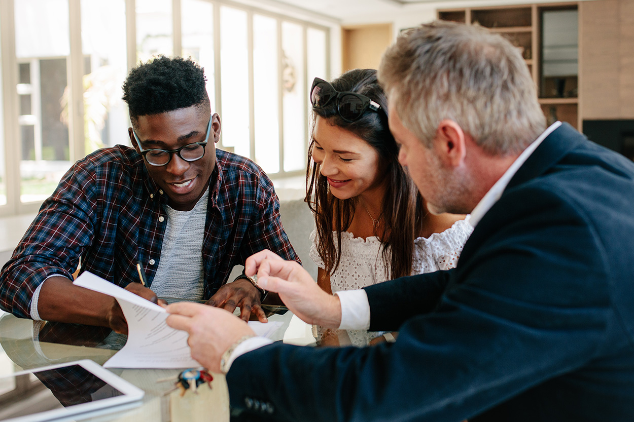 Young couple meeting with their realtor