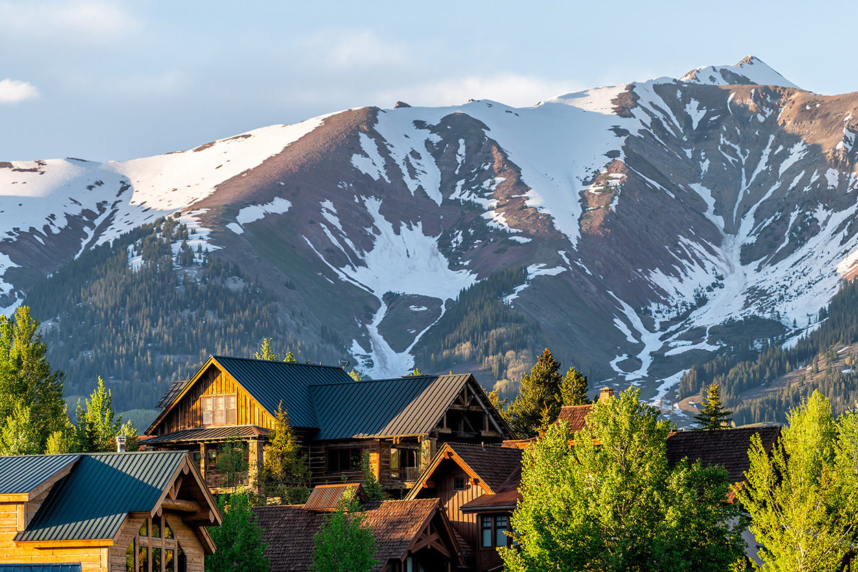 View of houses in Colorado with mountains in the background