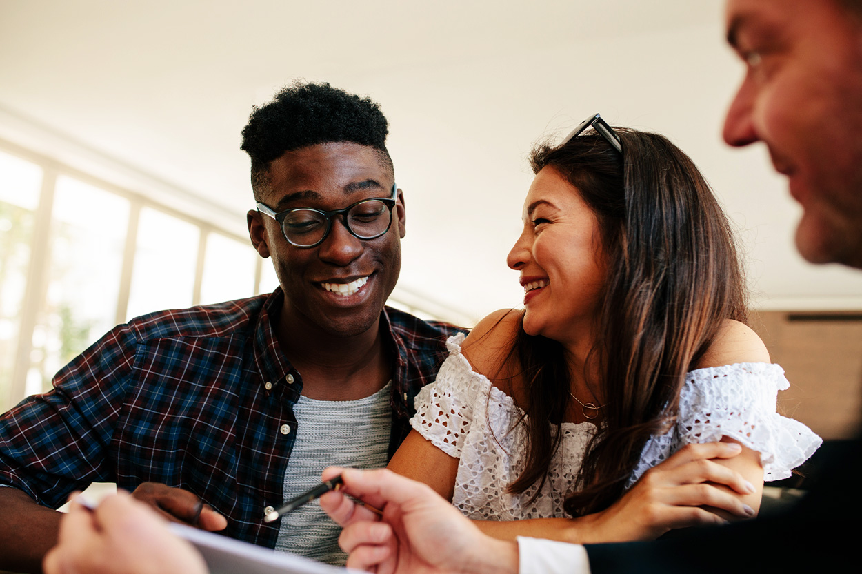 Young Couple talking to lender