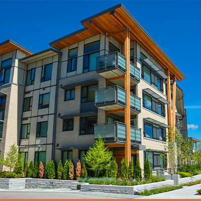 Exterior view of condo building with blue skies