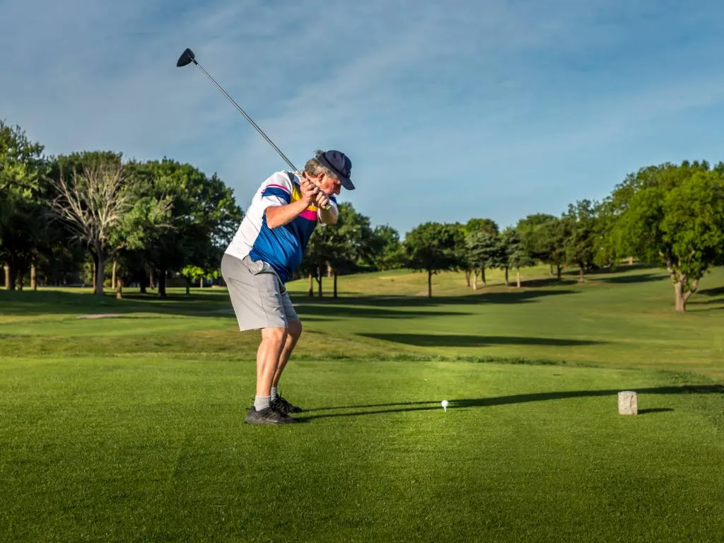 A Texas man teeing off at a golf course.